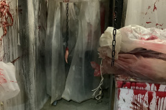 1_Actor-View-from-Behind-Butcher-Table-in-Butcher-Room